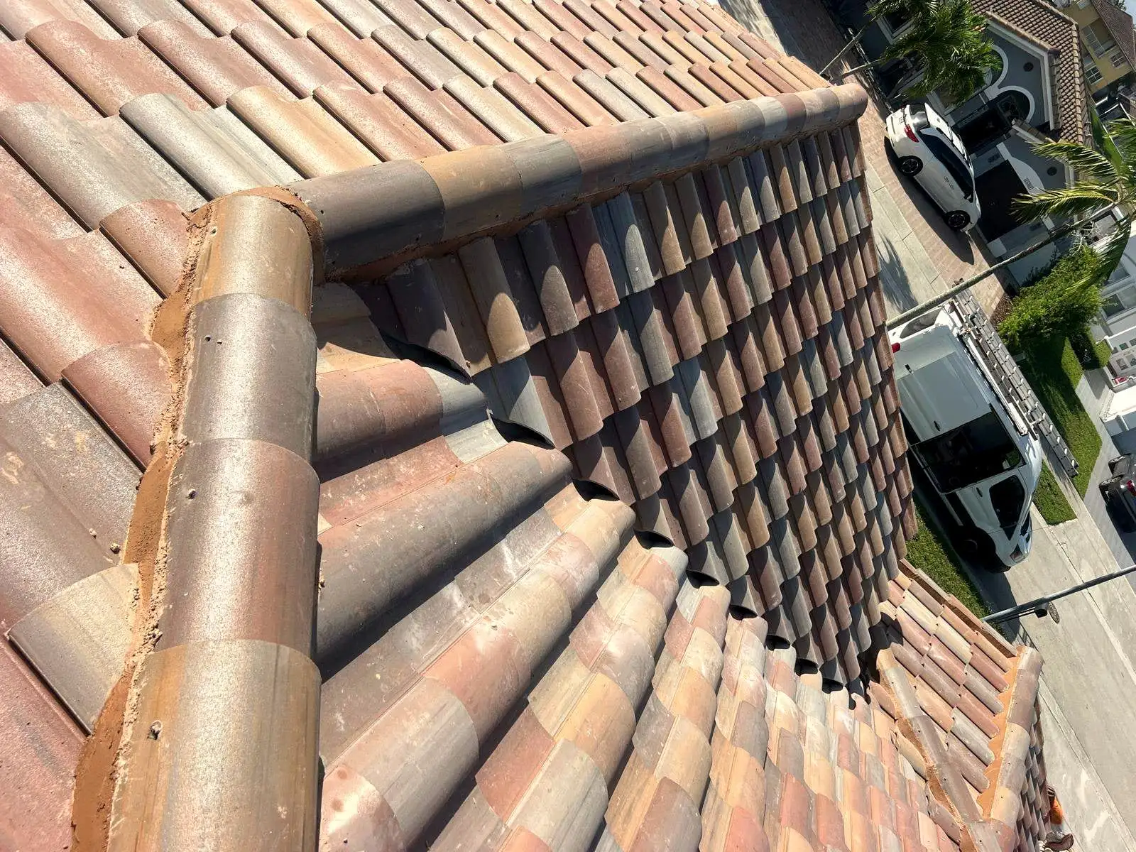 Barrel tile hip and ridge on a South Florida roof, seen up close